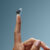 invisible hearing aids in Thunder Bay finger holding up a zeal hearing aid